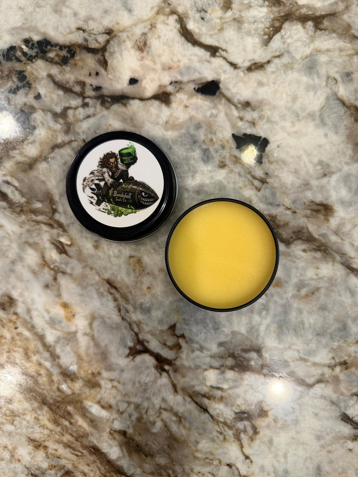 The Bouncer Beard Bomb open tin on marble